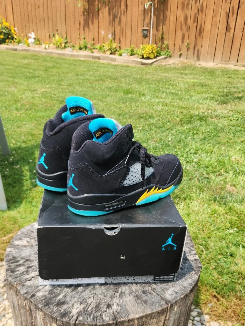 Jordan Retro 5 Sneakers in Black with Teal and Yellow Accents